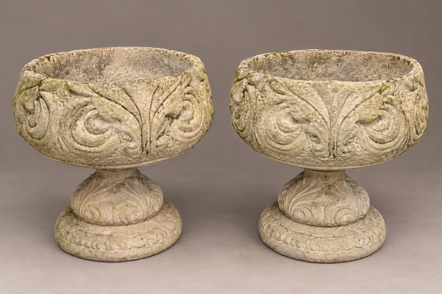 Presentation image of matching pair of ornamental stone garden urns